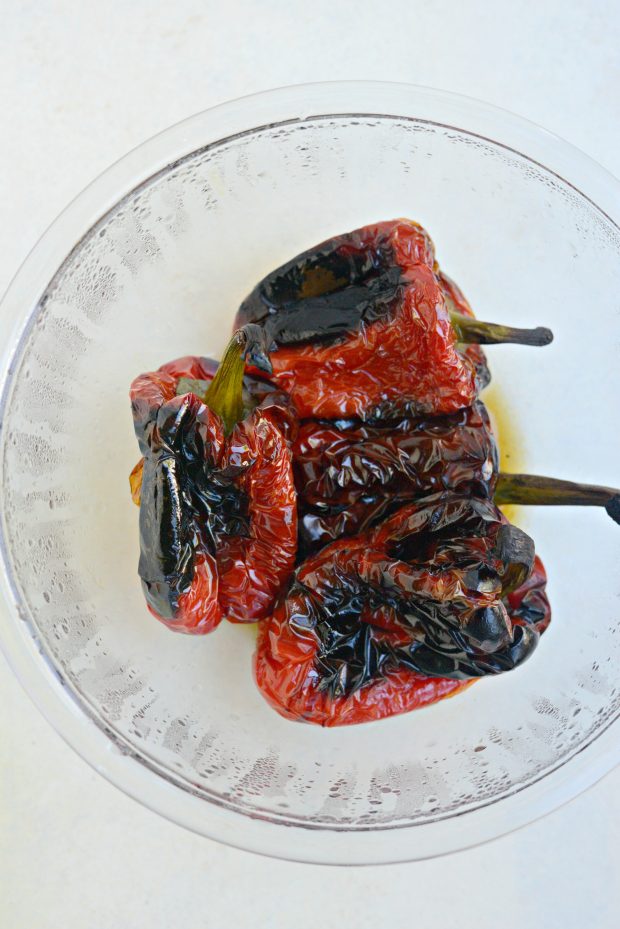 Transfer roasted red peppers to boil and cover with plastic wrap to steam