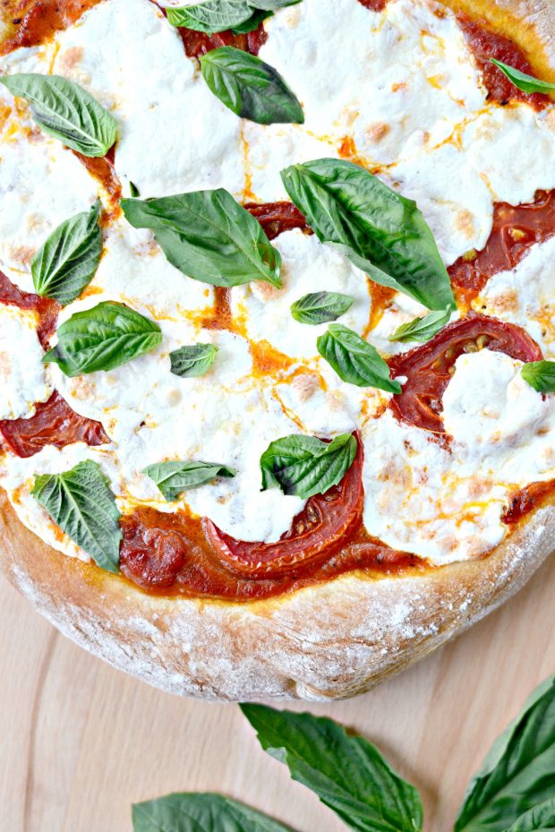 bake the Classic Margherita Pizza and top with basil