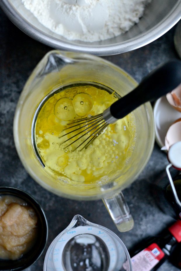 Whisk eggs and add in the buttermilk and oil, applesauce, vinegar and vanilla extract.