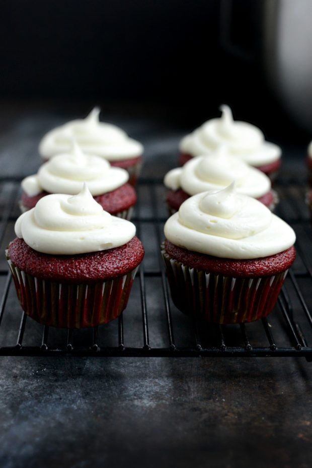 pipe frosting on to cupcakes.