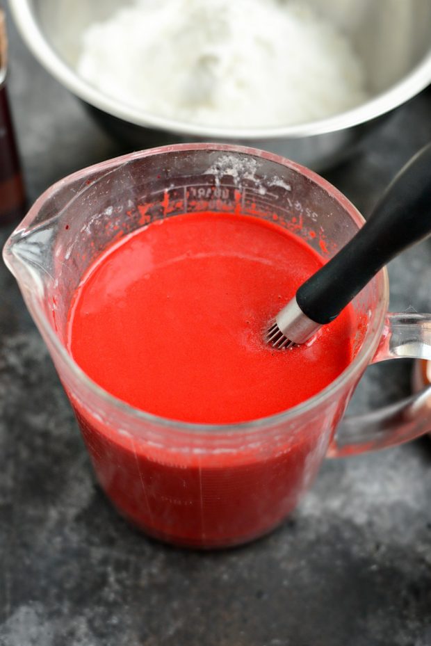 dyed wet ingredients in measuring cup.