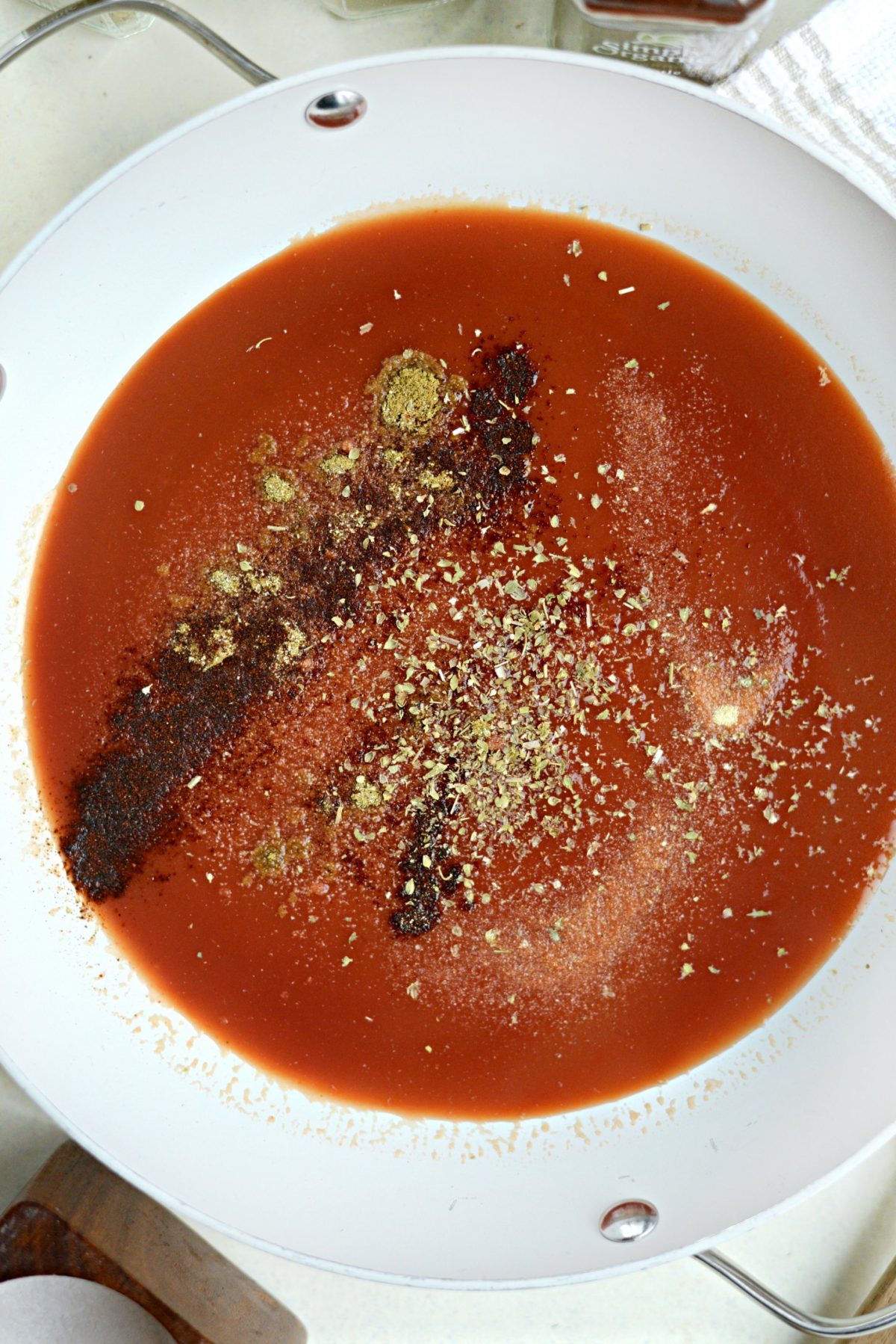 tomato sauce and spices in pan