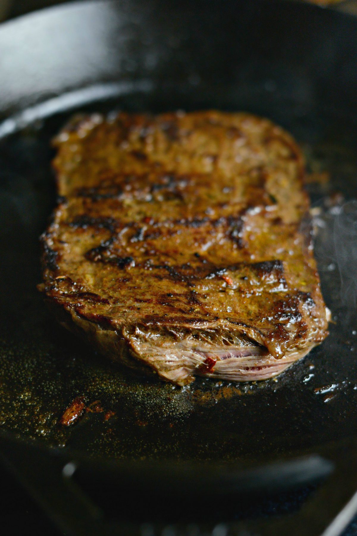 cooking steak in cast iron skillet