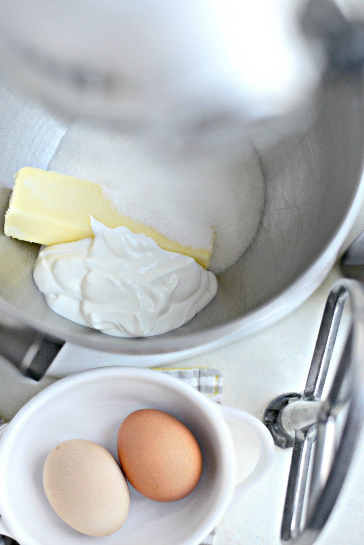 Add sugar, butter and sour cream in mixing bowl.