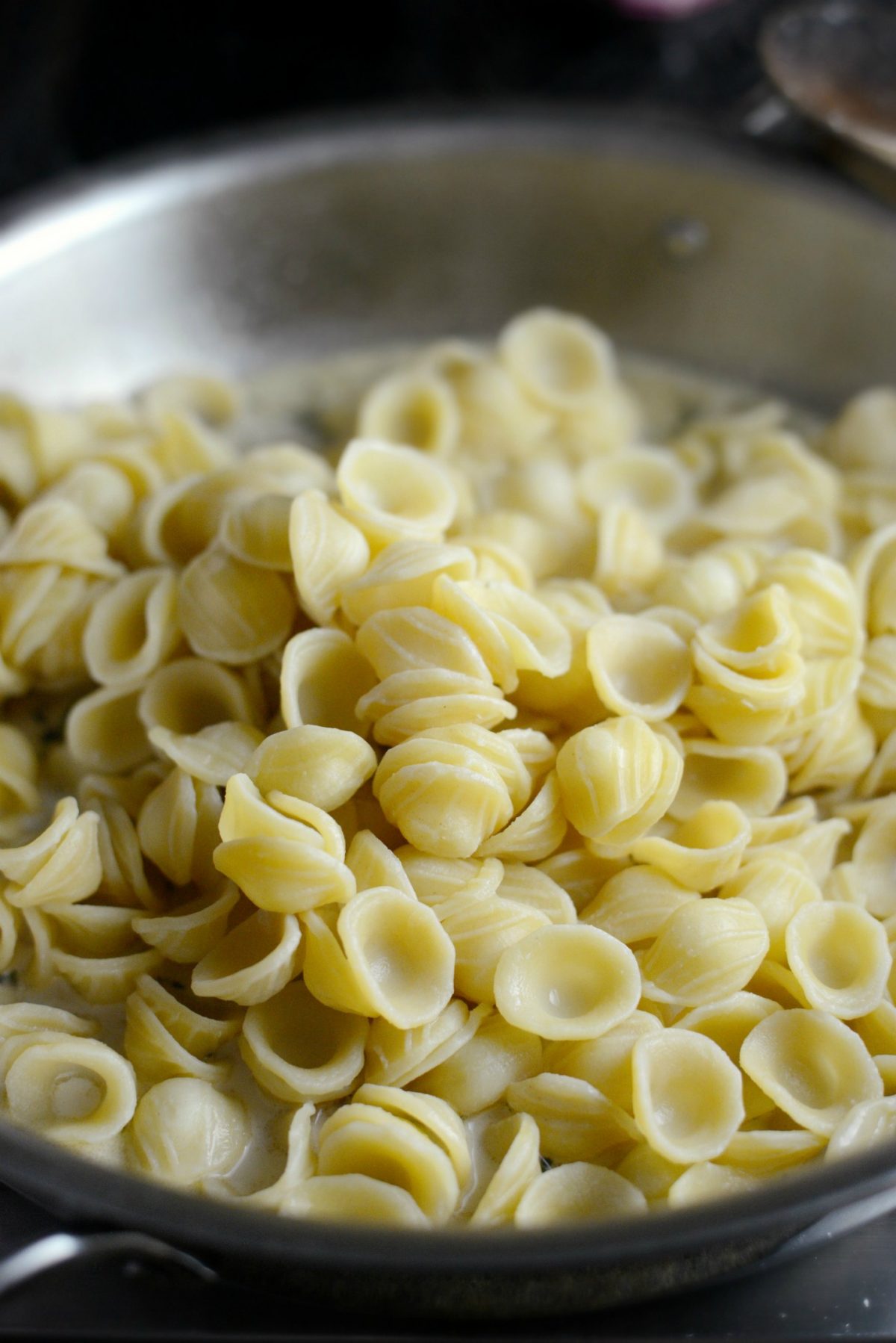 cooked pasta added to skillet.