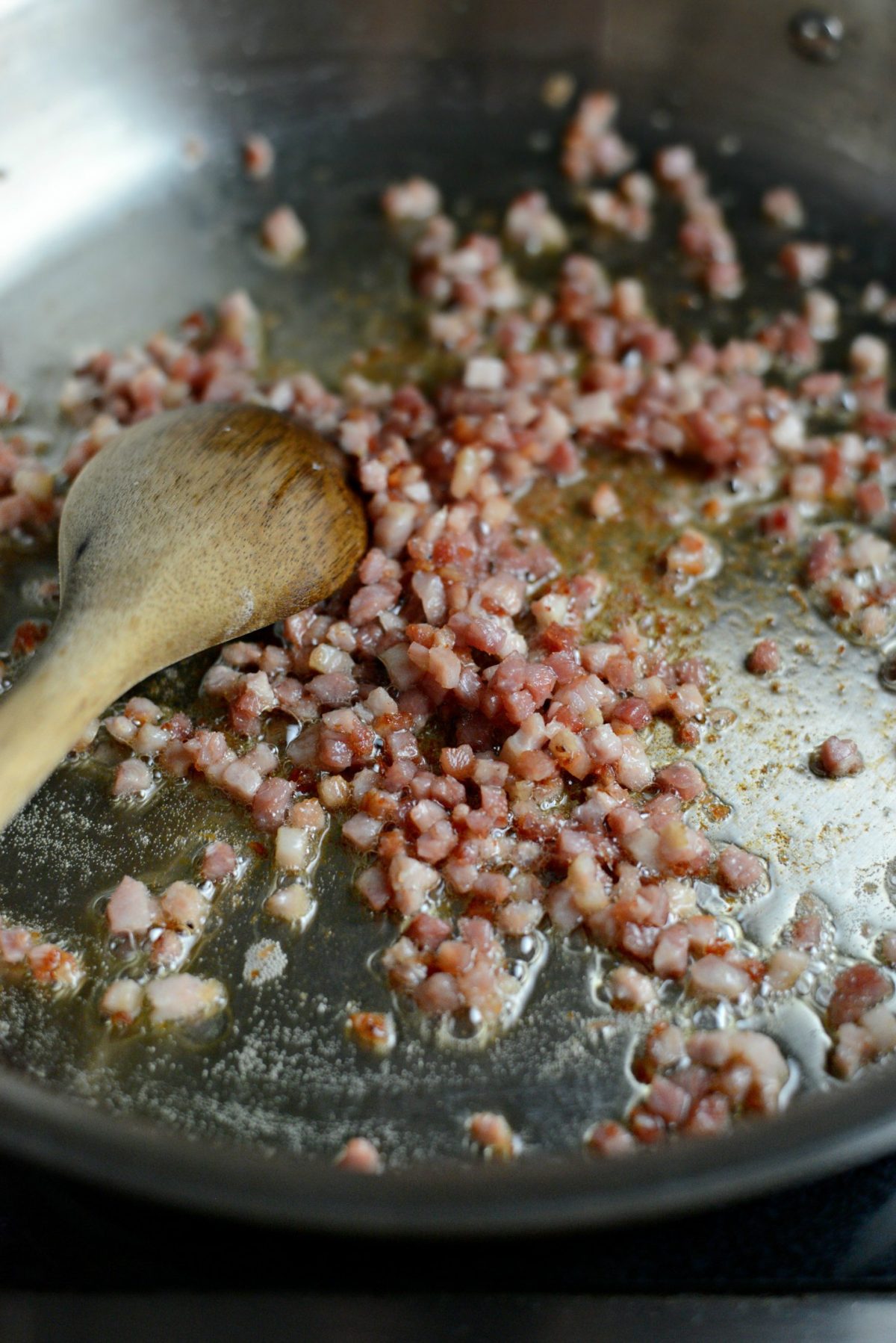 crispy cooked pancetta in skillet.