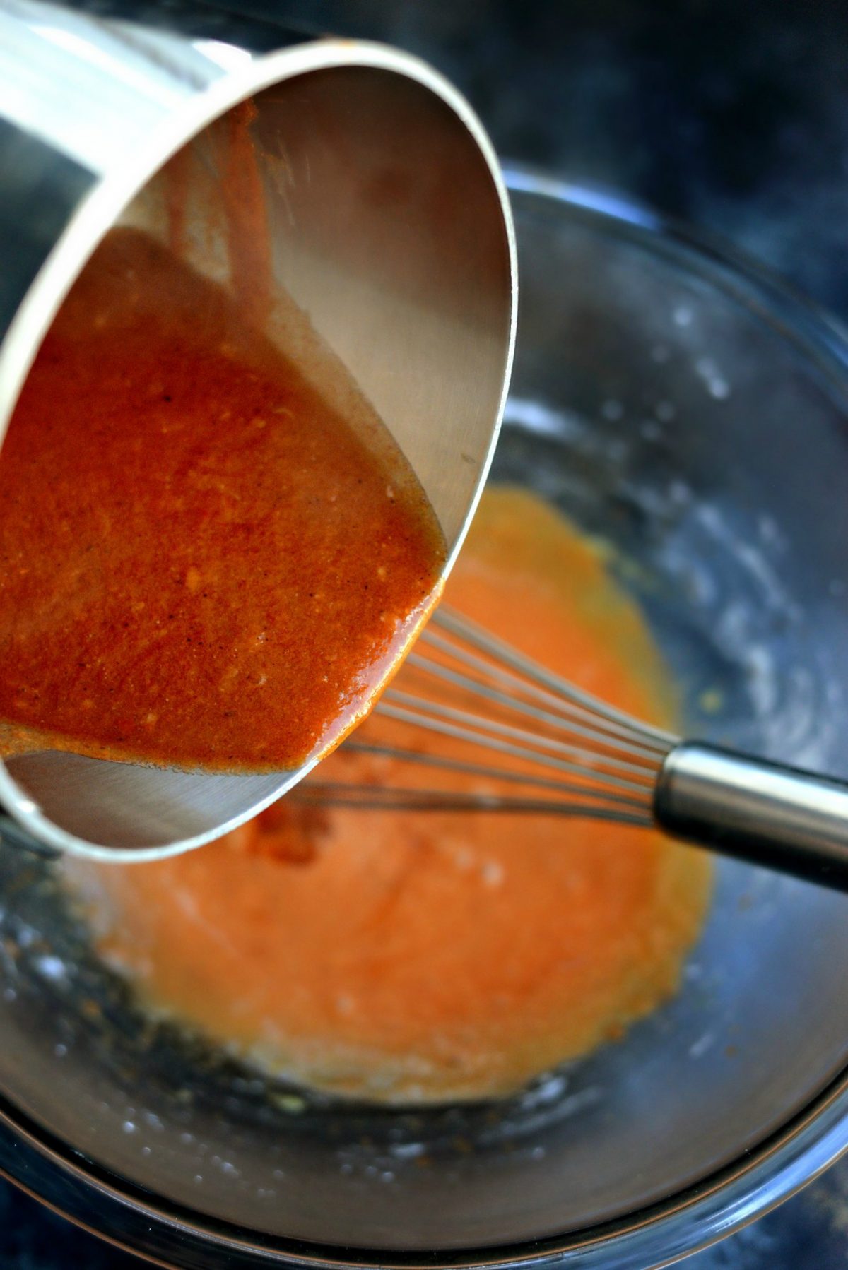 whisk while pouring in the hot garlic sauce.