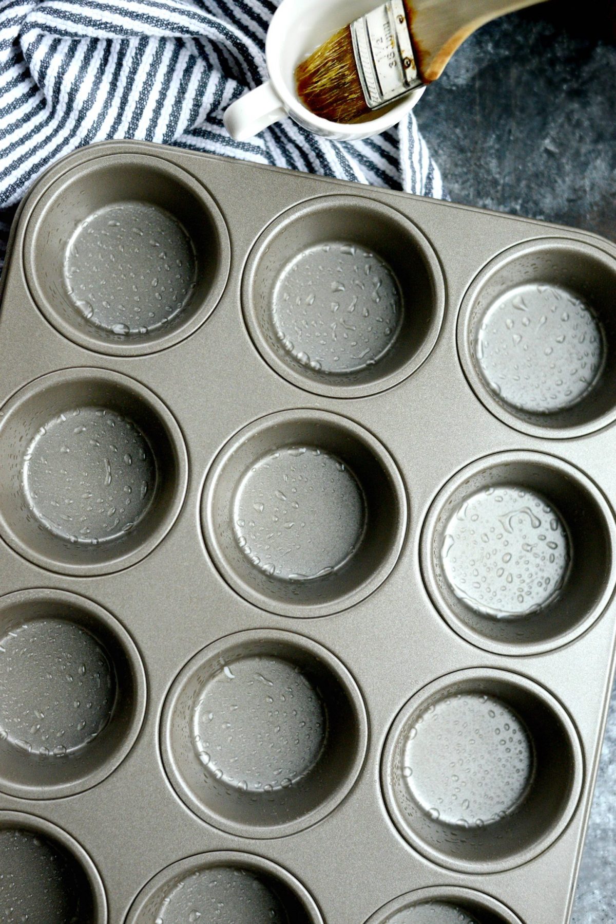 greased muffin tin