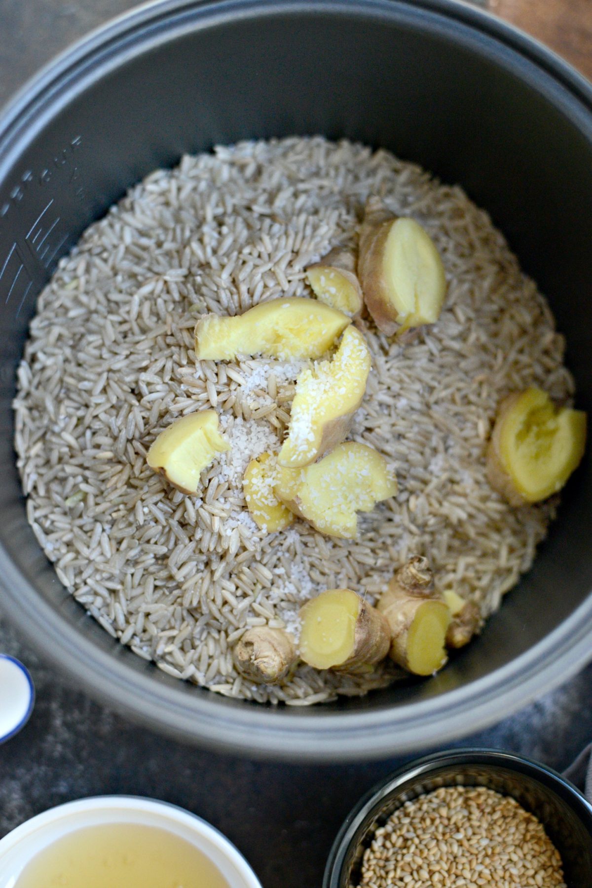 Add rice, ginger and salt to rice cooker