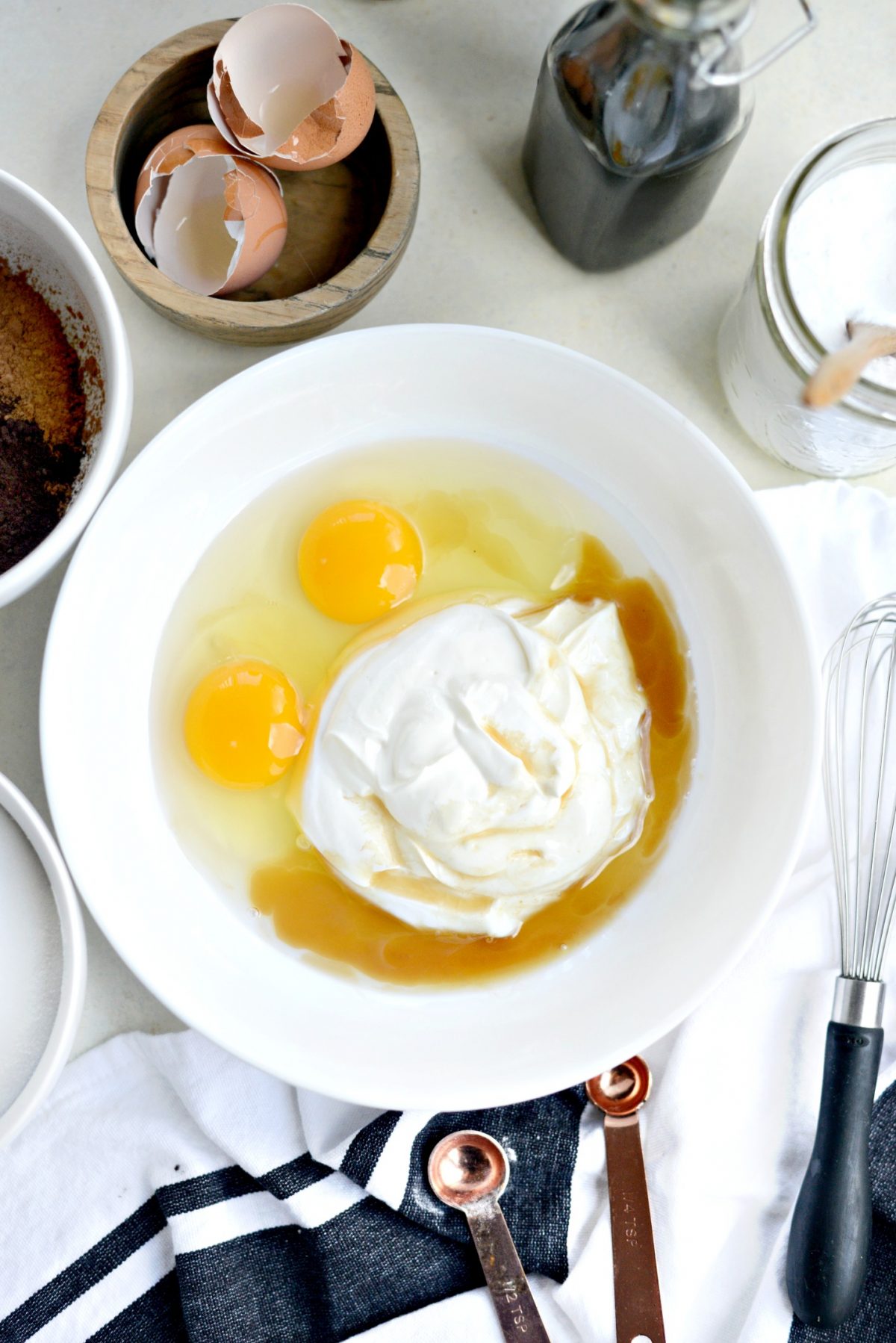 sour cream eggs and vanilla in bowl.