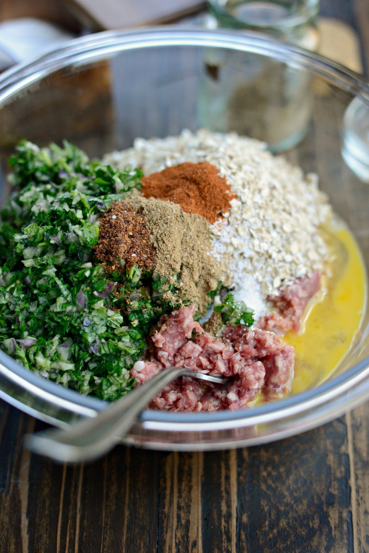 Add meatball ingredients into a mixing bowl.