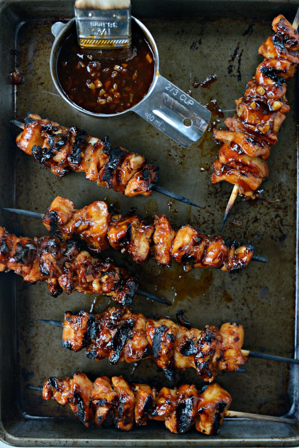 Grilled Sticky Sweet Chicken Skewers on rimmed baking sheet.