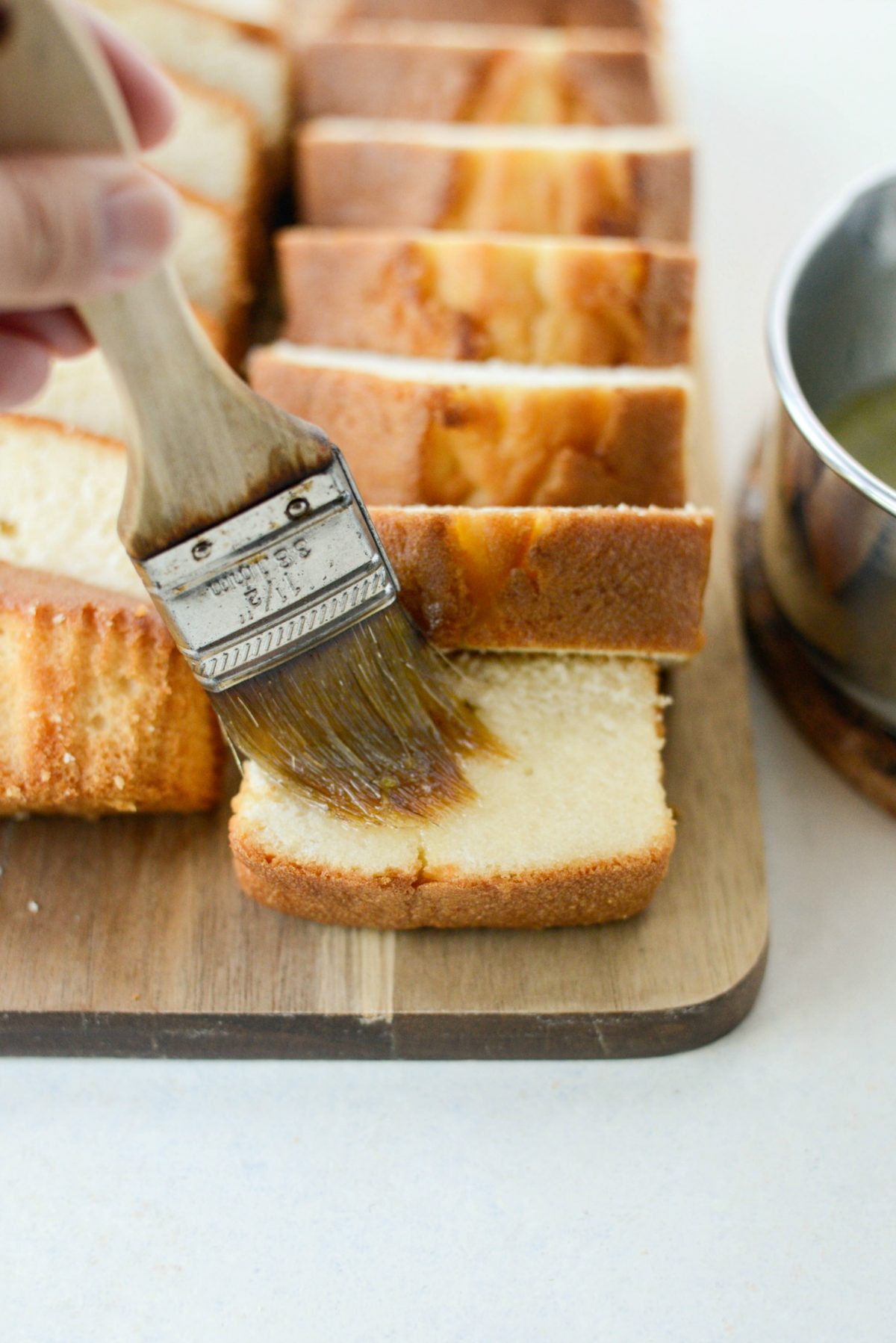 brush sliced pound cake with the simple syrup