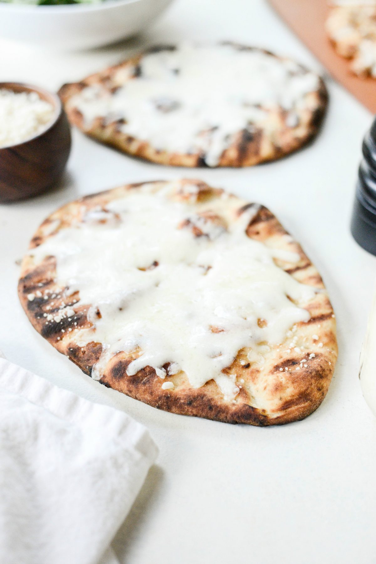 grilled naan with melted cheese