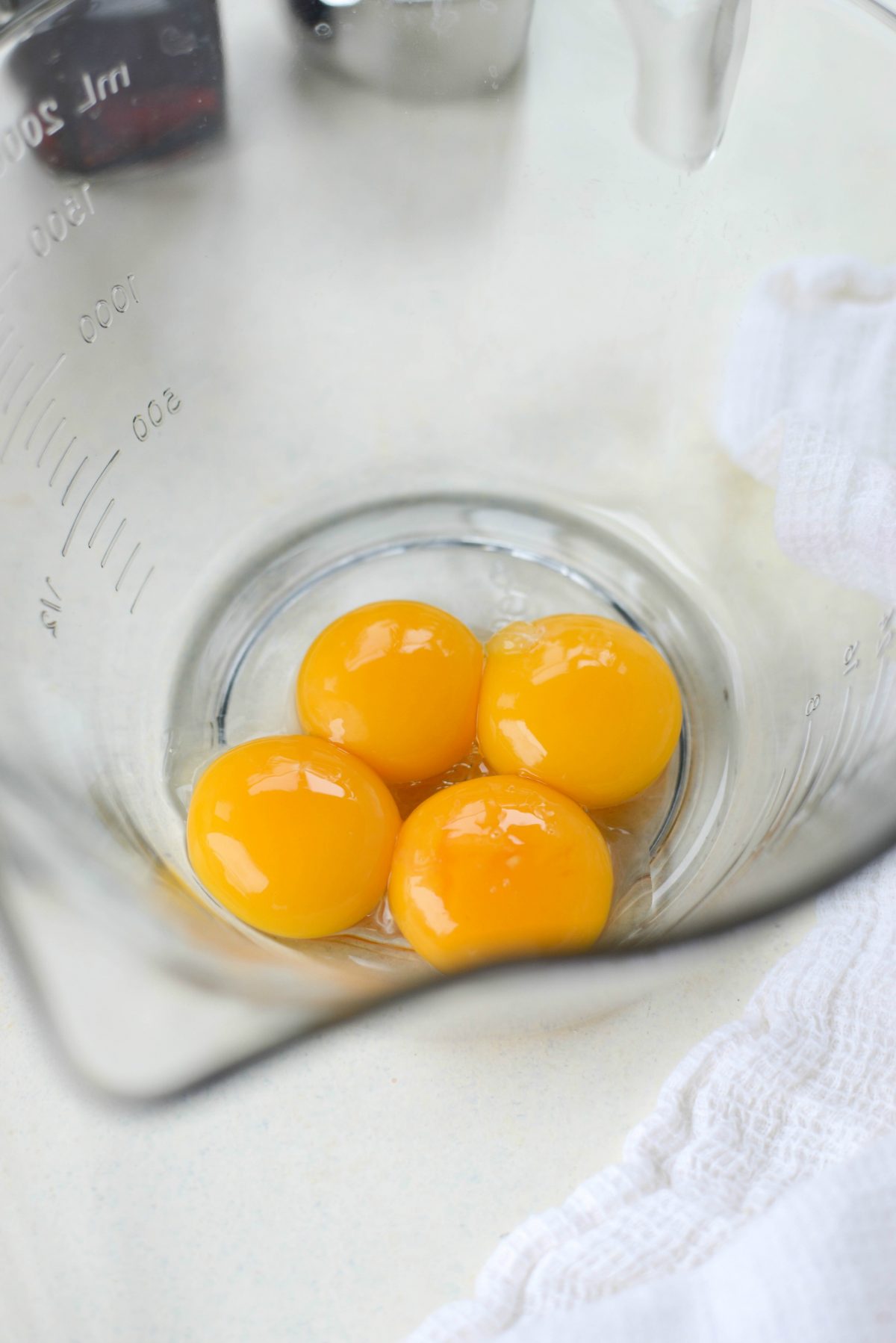 Add egg yolks to bowl