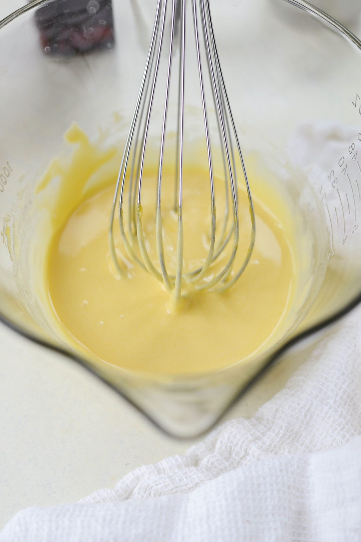 Whisk to combine and until a pale yellow in color.