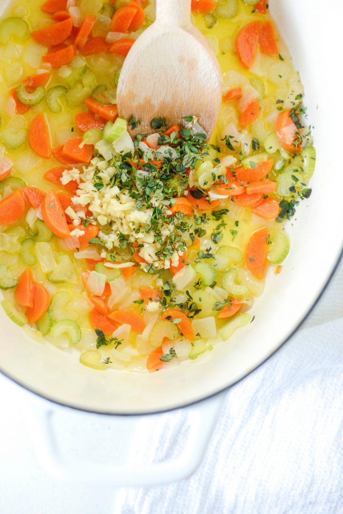 Add garlic and thyme to sautéed veggies