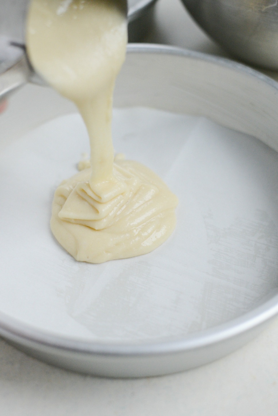 divide cake batter among prepared cake pans