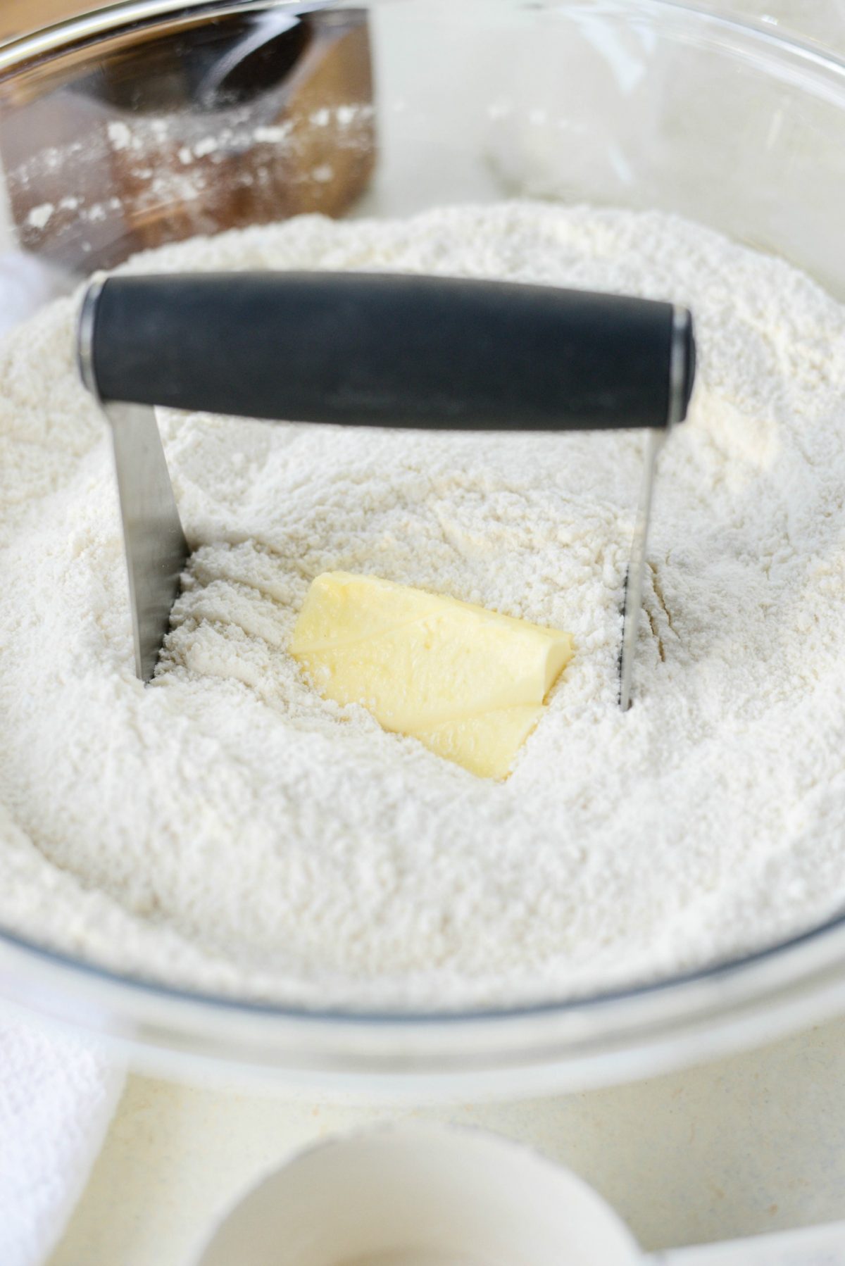 add in softened unsalted butter and blend that in with a pastry cutter.