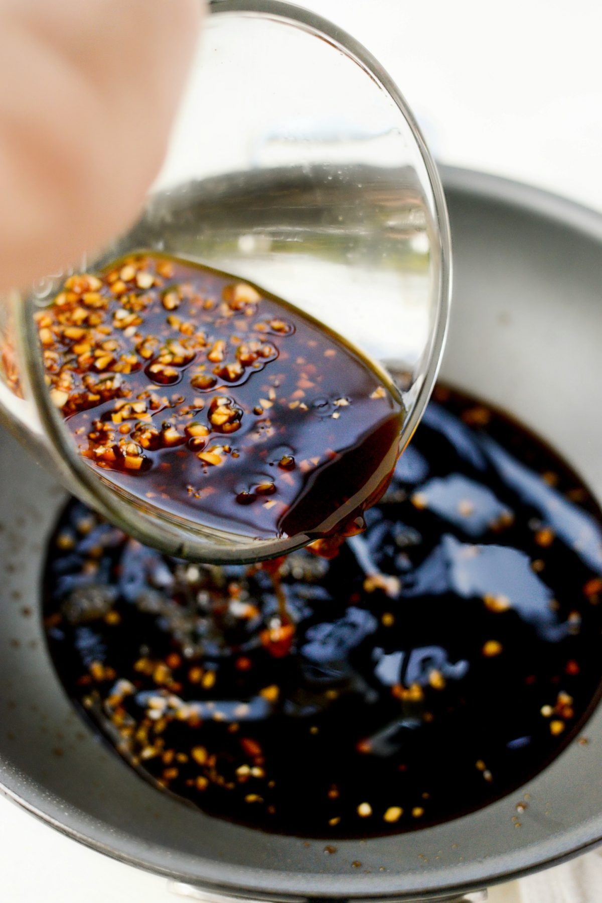 remove most oil from pan and pour in sauce.