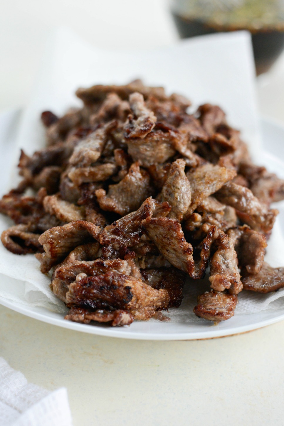 Transfer cooked beef to a paper towel lined plate.