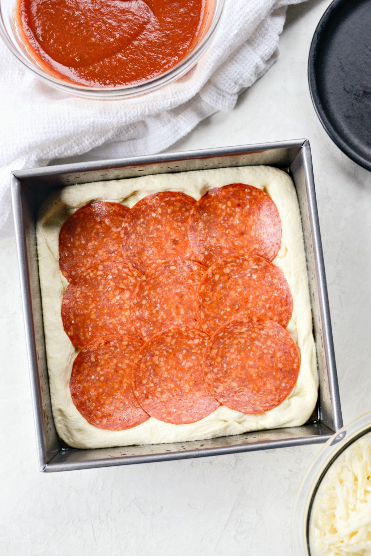 press dough into pan and top with sandwich pepperoni