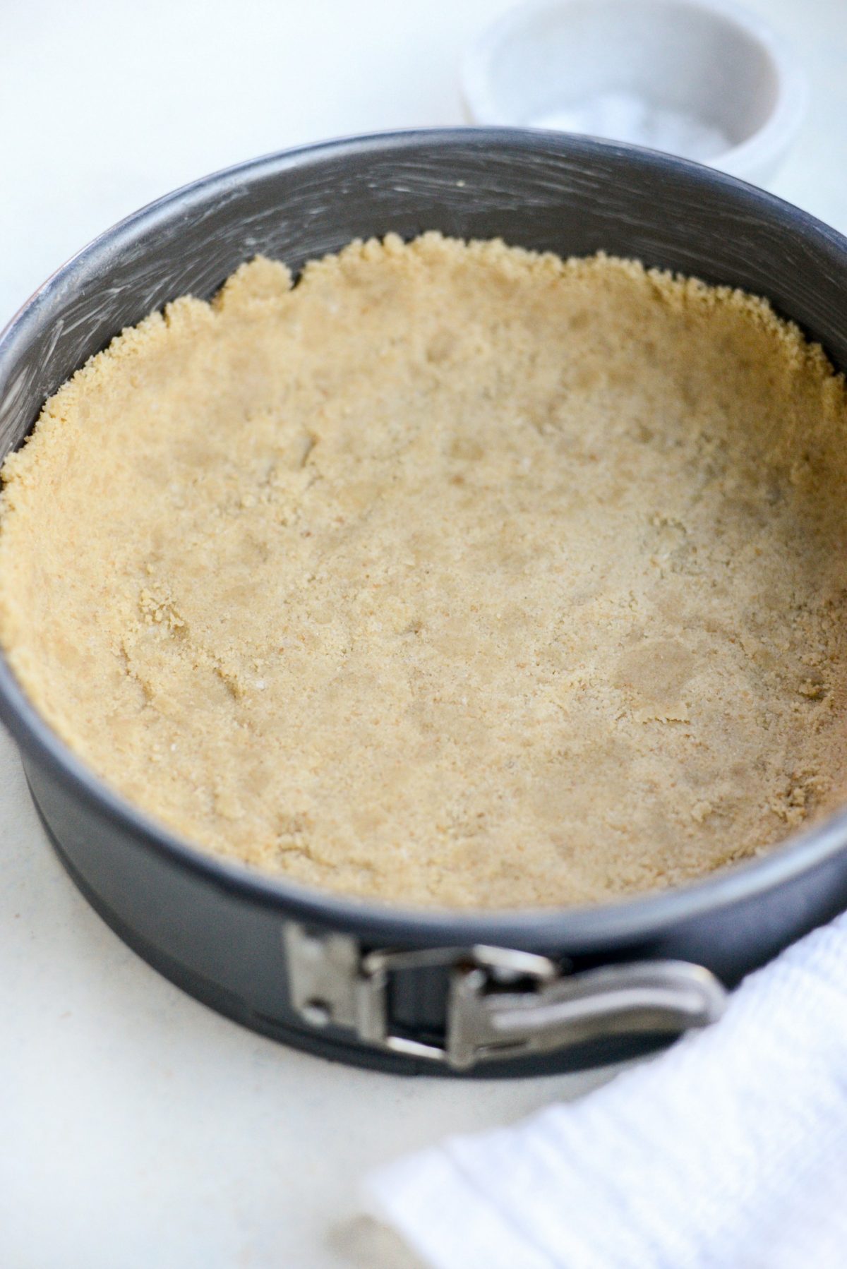 press crust into greased pan.