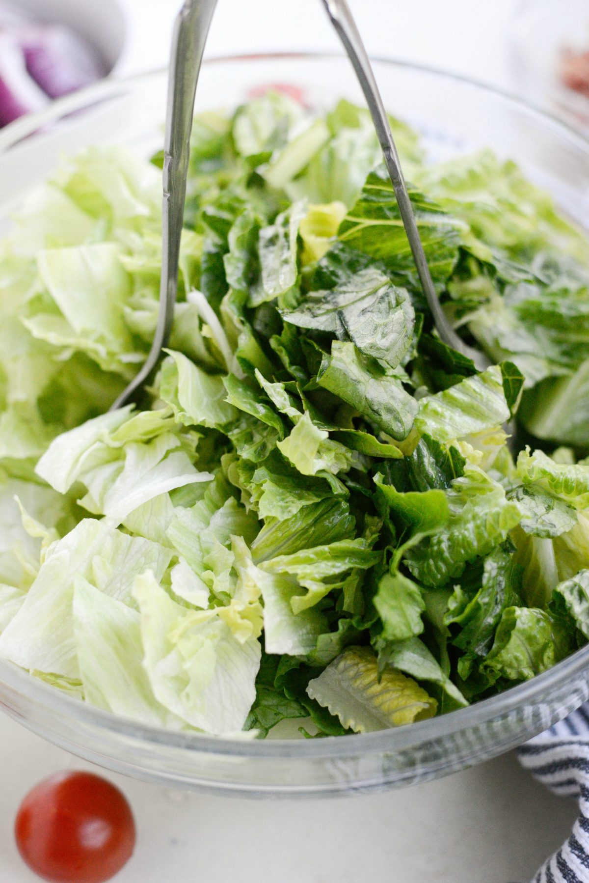 toss salad greens with dressing