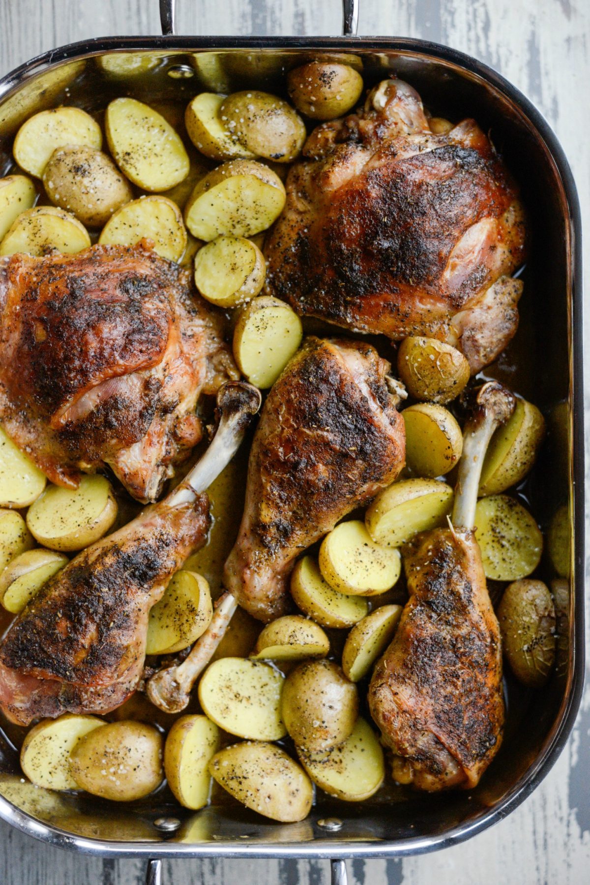 Roasted Turkey Thighs and Drumsticks in a roasting sheet pan.