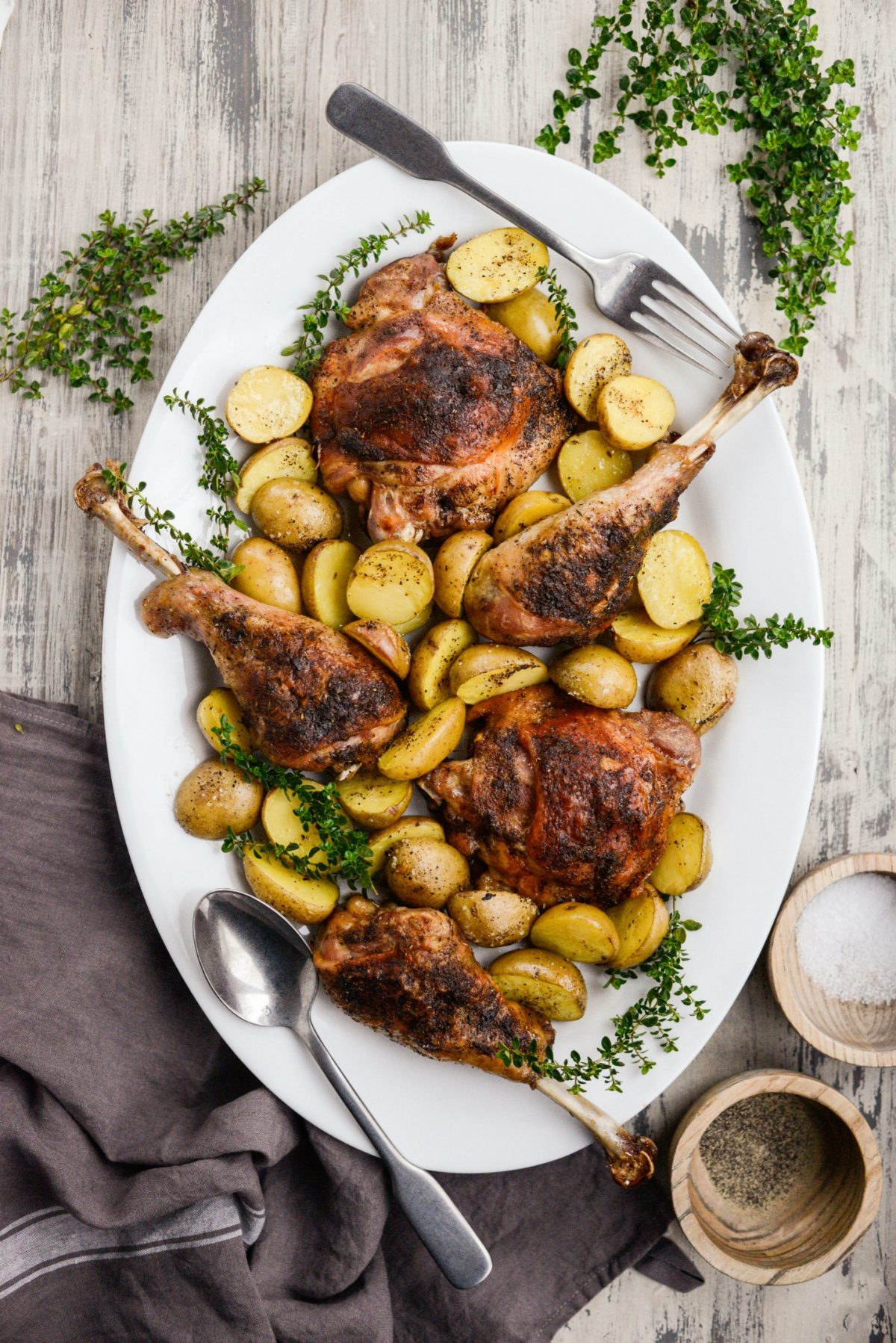 Serving Roasted Turkey Thighs and Drumsticks family style on a large platter.