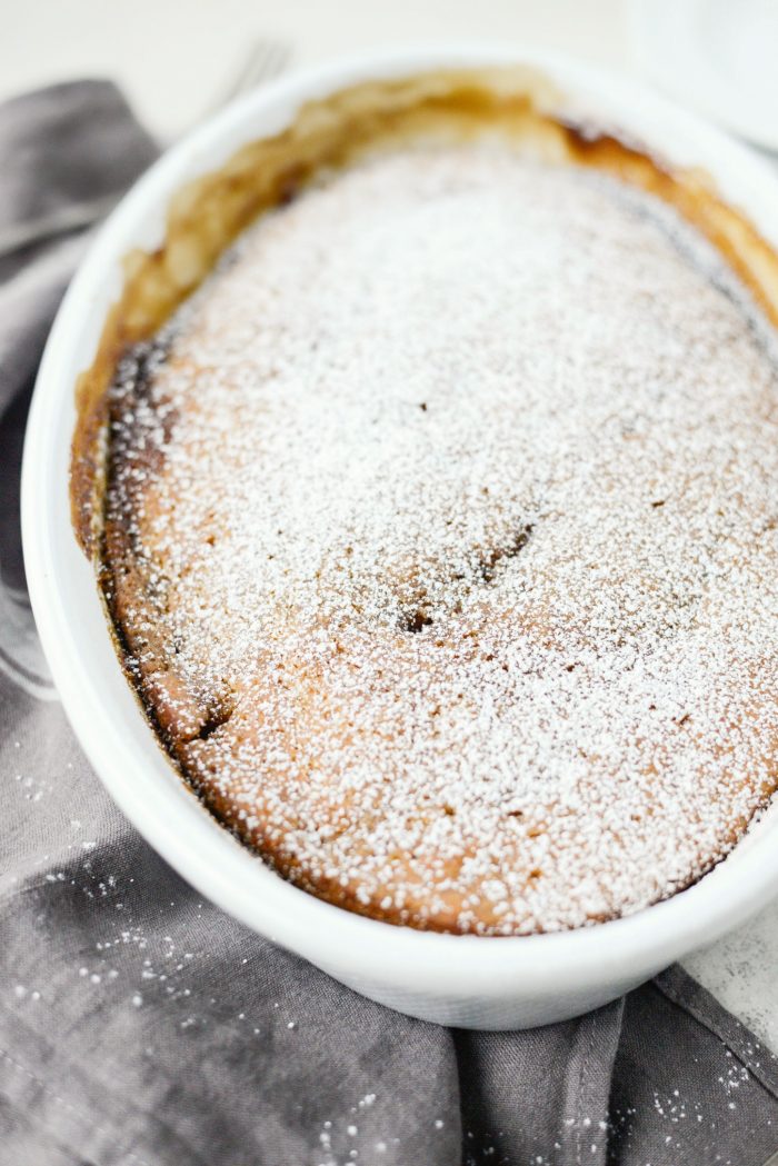 dust Warm Pumpkin Pudding Cake with powdered sugar