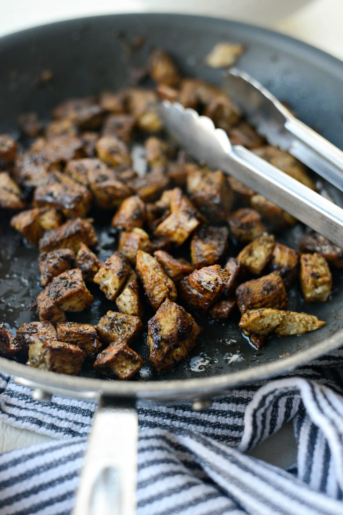 chop chicken and add back to the skillet to pick up flavors in trepan.