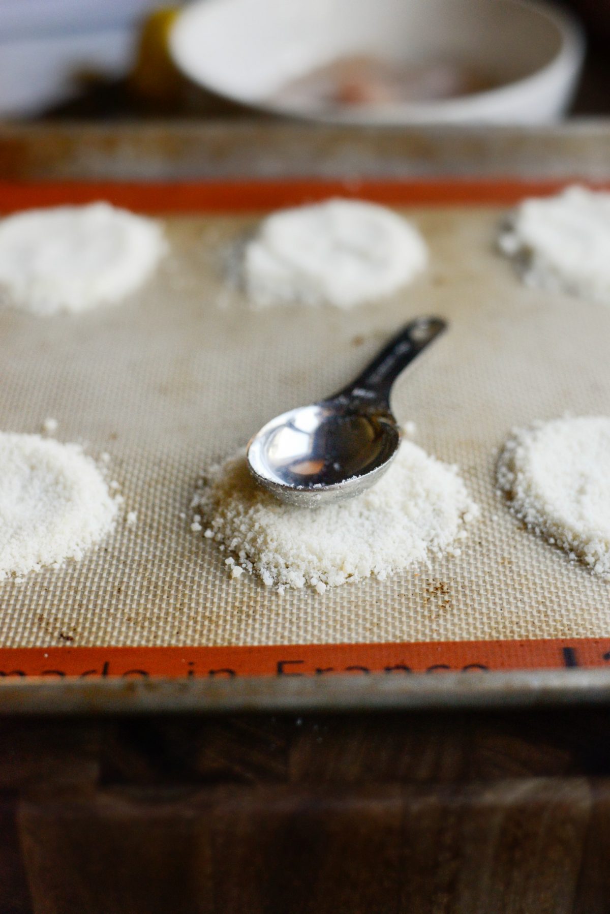 smooth out the parmesan with the back of the spoon 