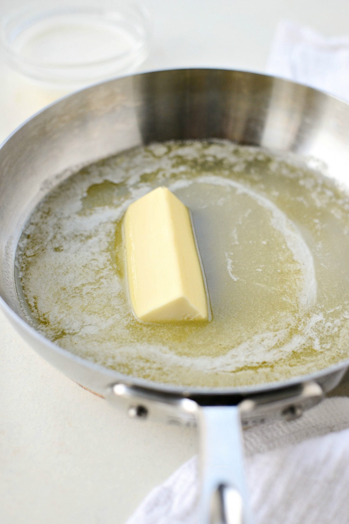 Making the butter rum sauce. Melt buttering skillet.