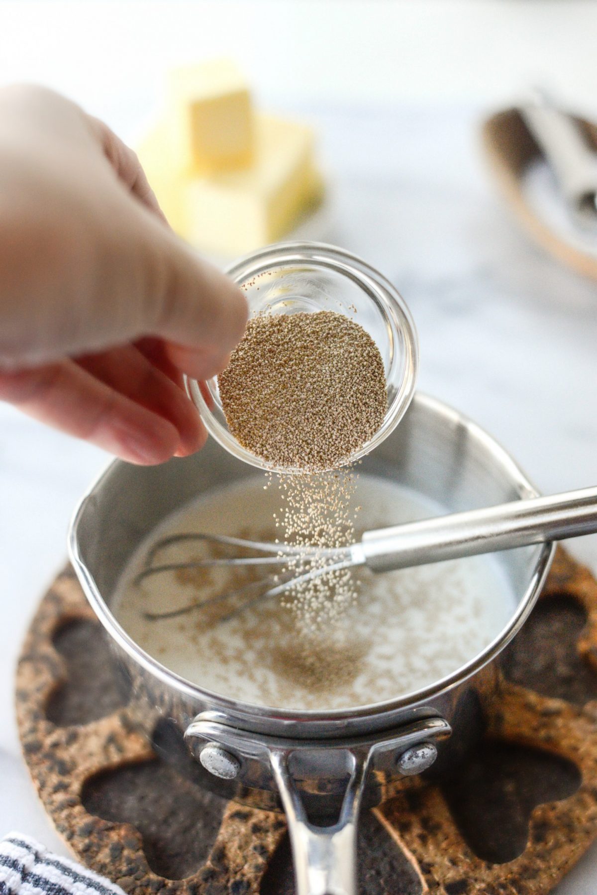 Add sugar and yeast to warm milk.