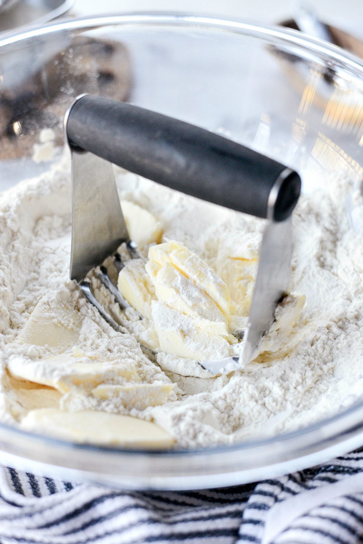 cut butter into dry ingredients using a pastry blender.