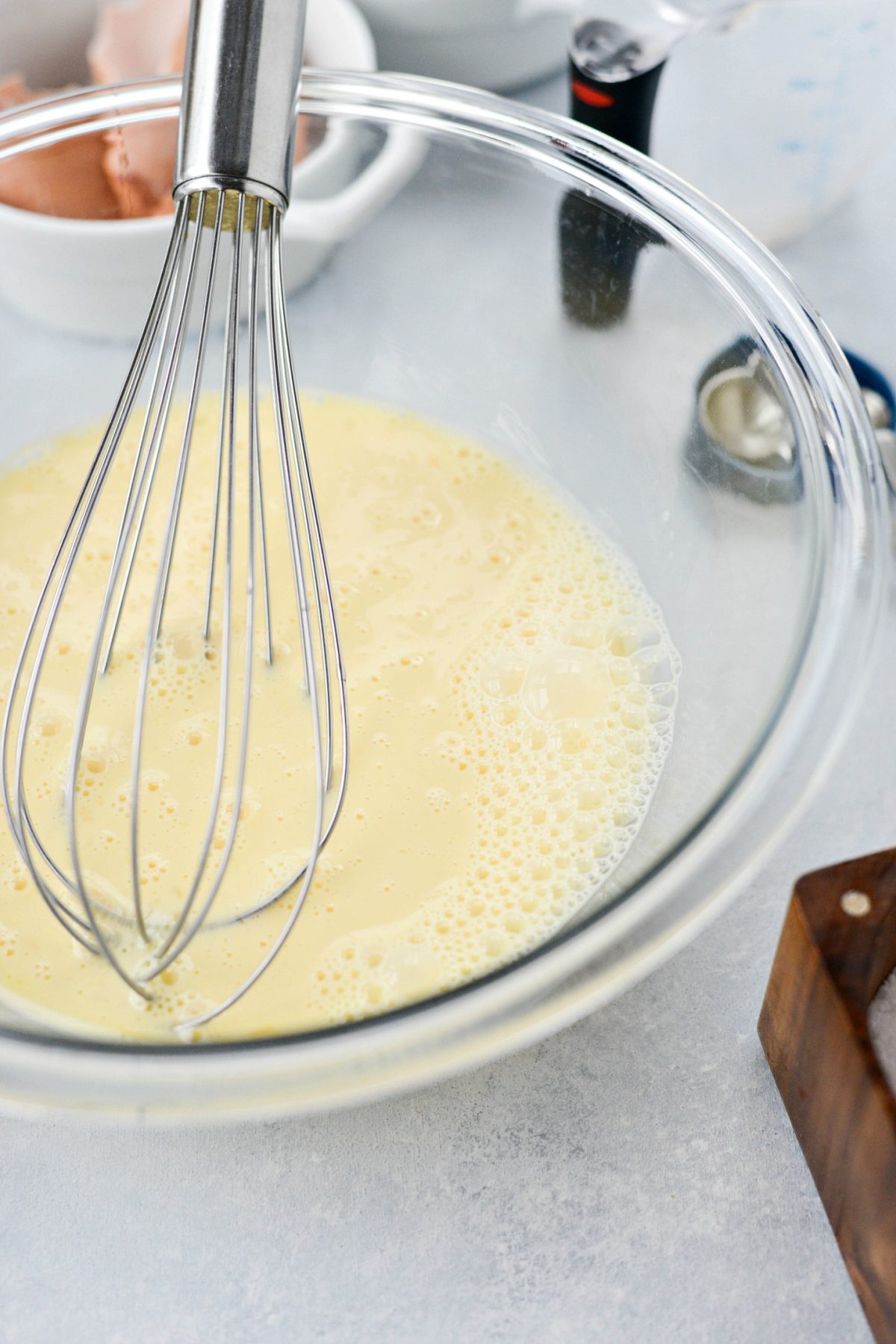 whisked eggs and milk in mixing bowl