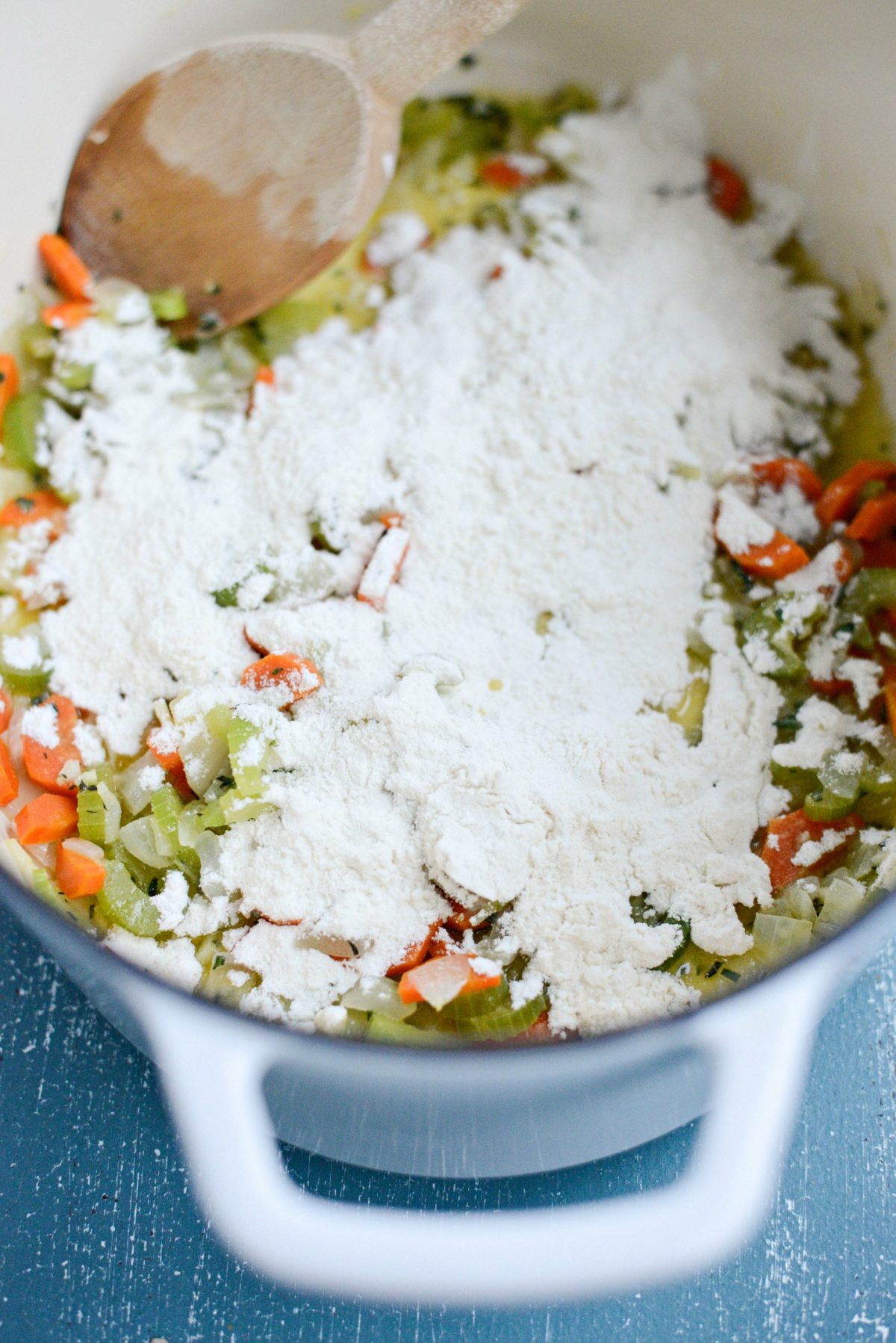 flour sprinkled over sautéed veggies and herbs.