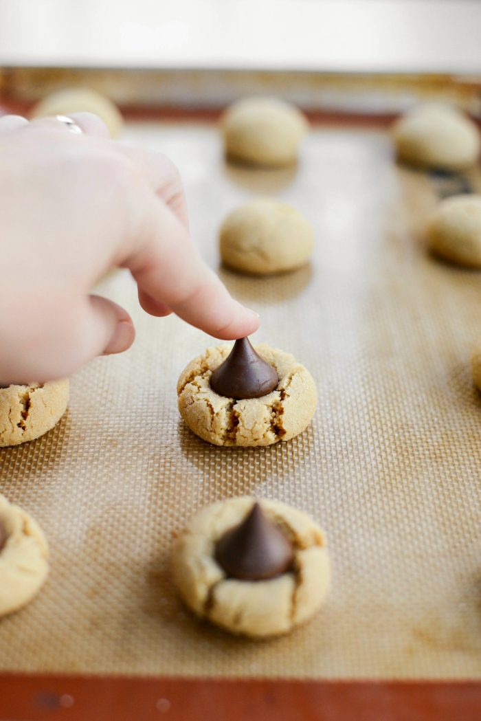 once baked, press kisses into the center