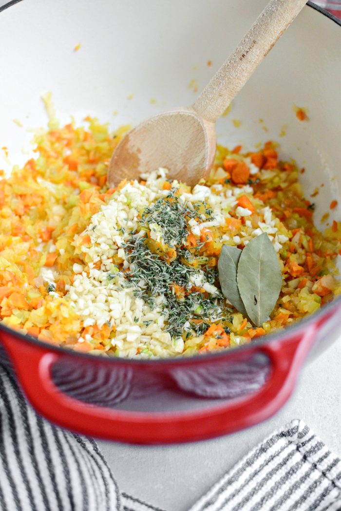 add in garlic, thyme and bay leaves
