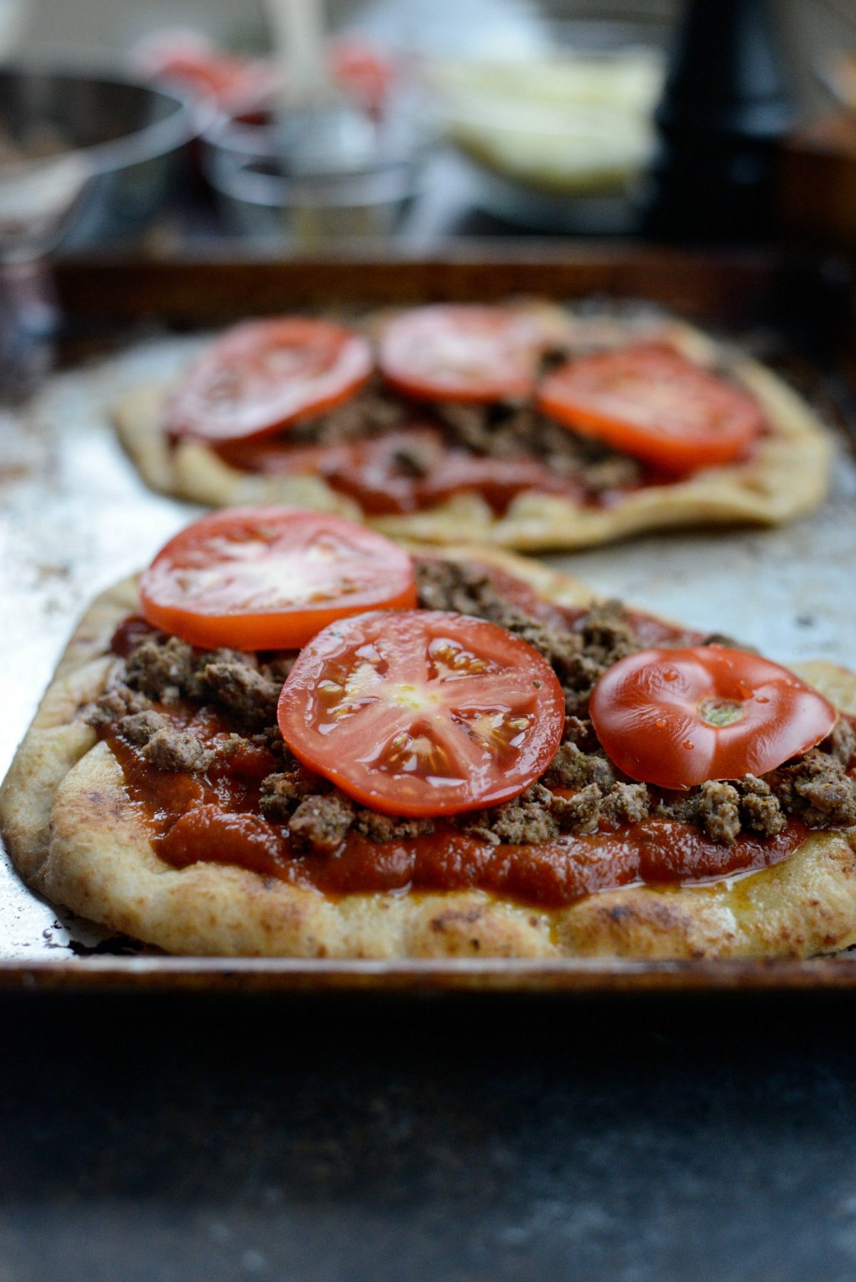 top with sliced tomatoes