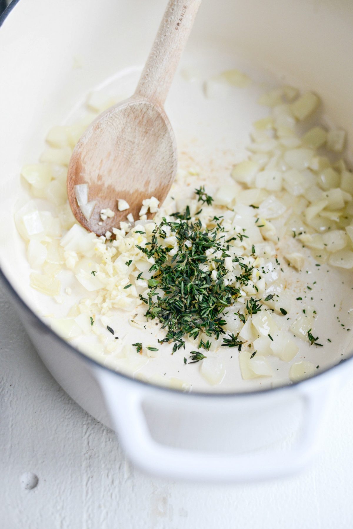 Saute onions and garlic with thyme.