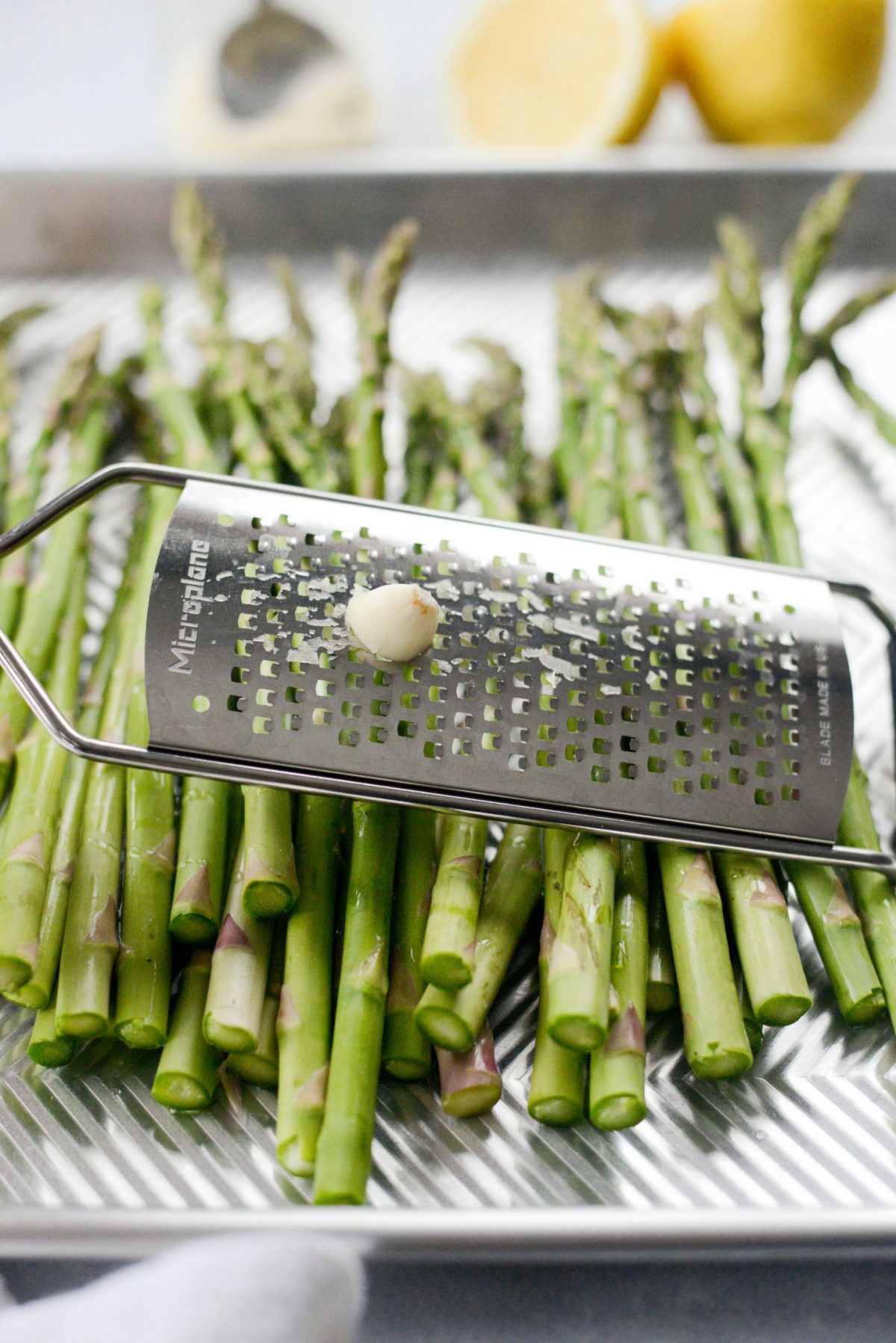 grate a large clove of garlic over the asparagus