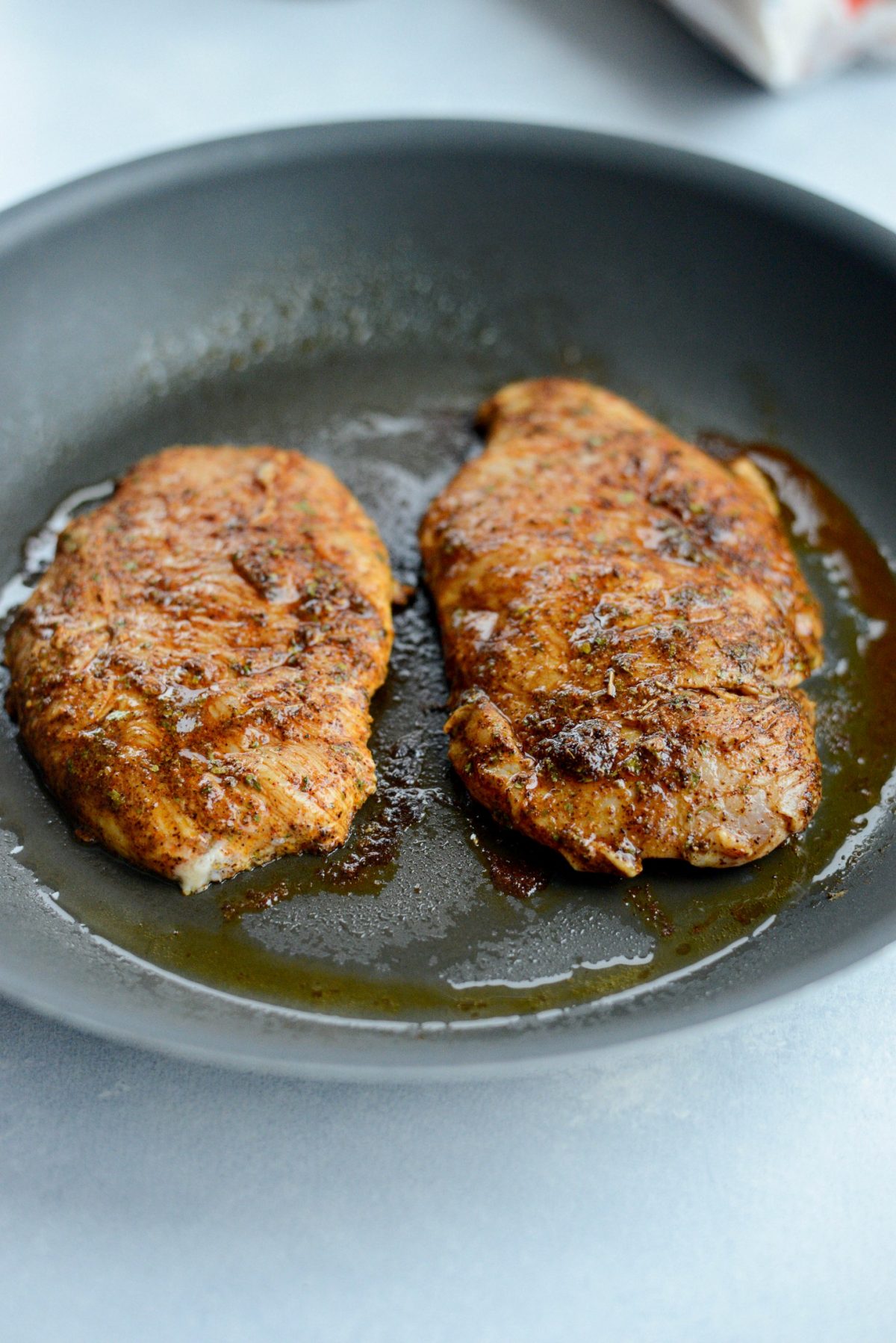 cook chicken breasts in skillet.