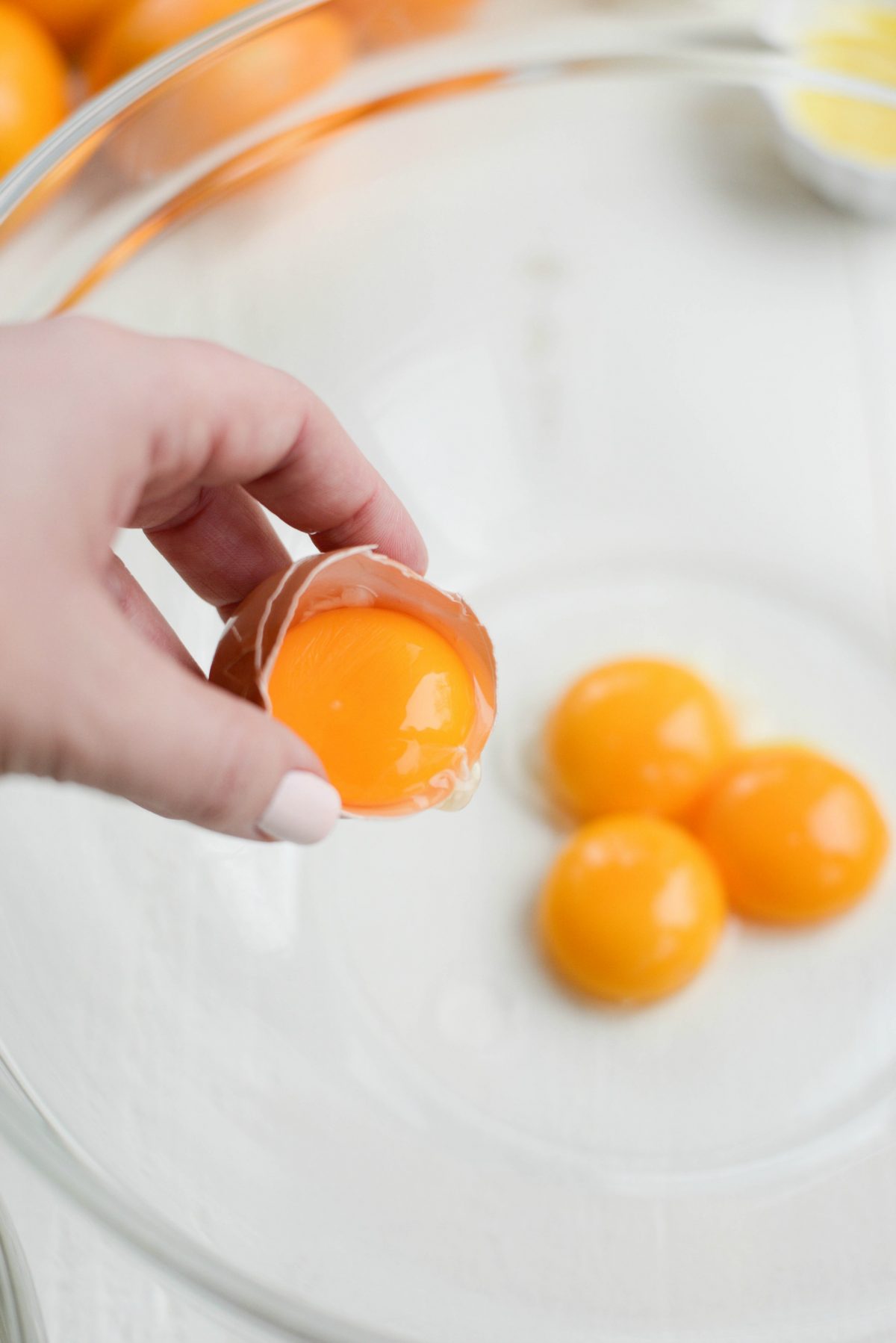 add egg yolks to bowl