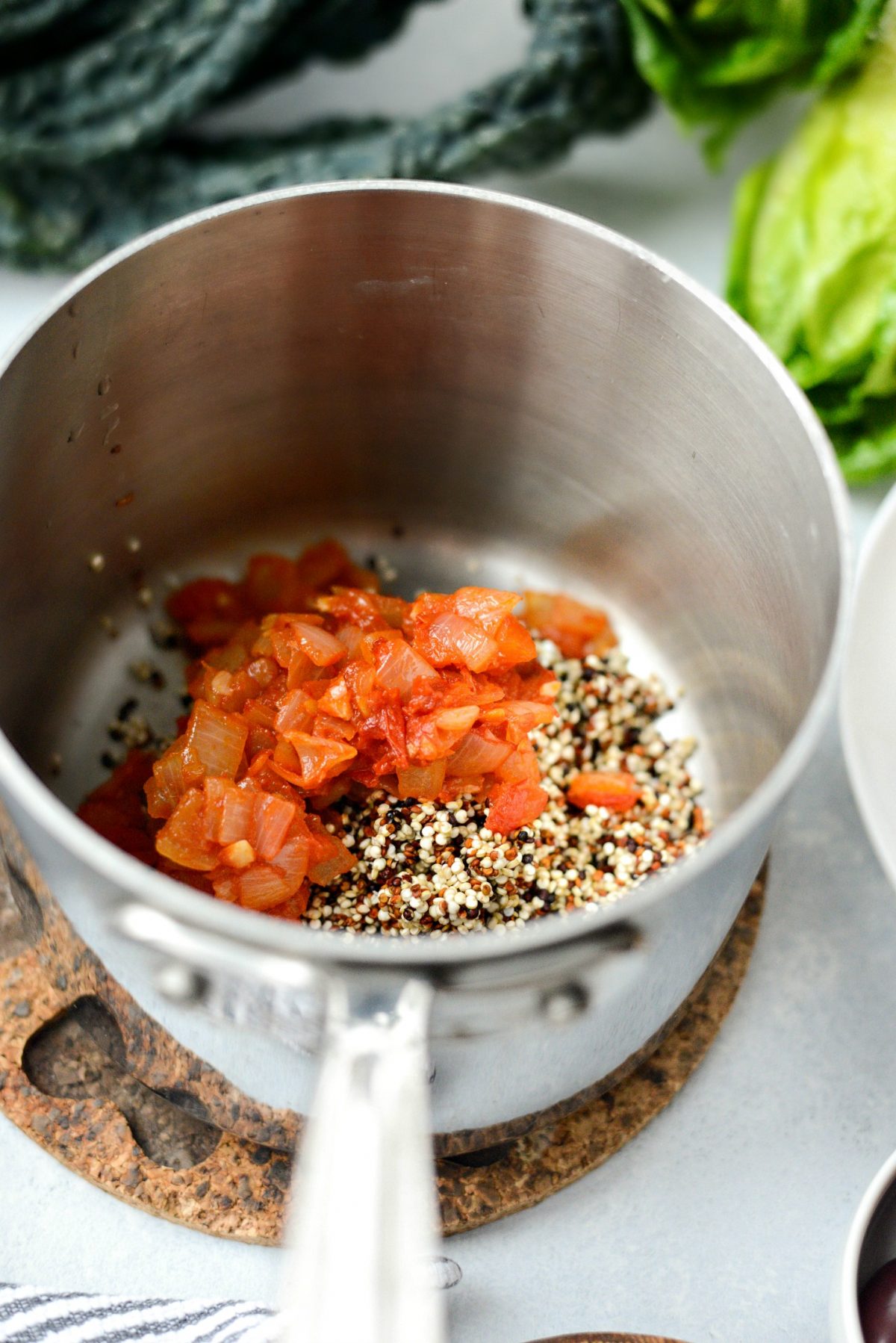 quinoa and sofrito in saucepan