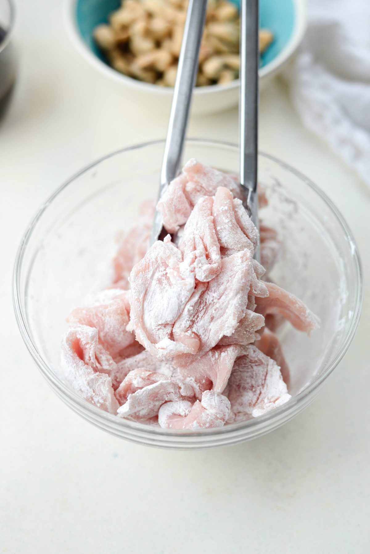 toss pork pieces in cornstarch and white pepper