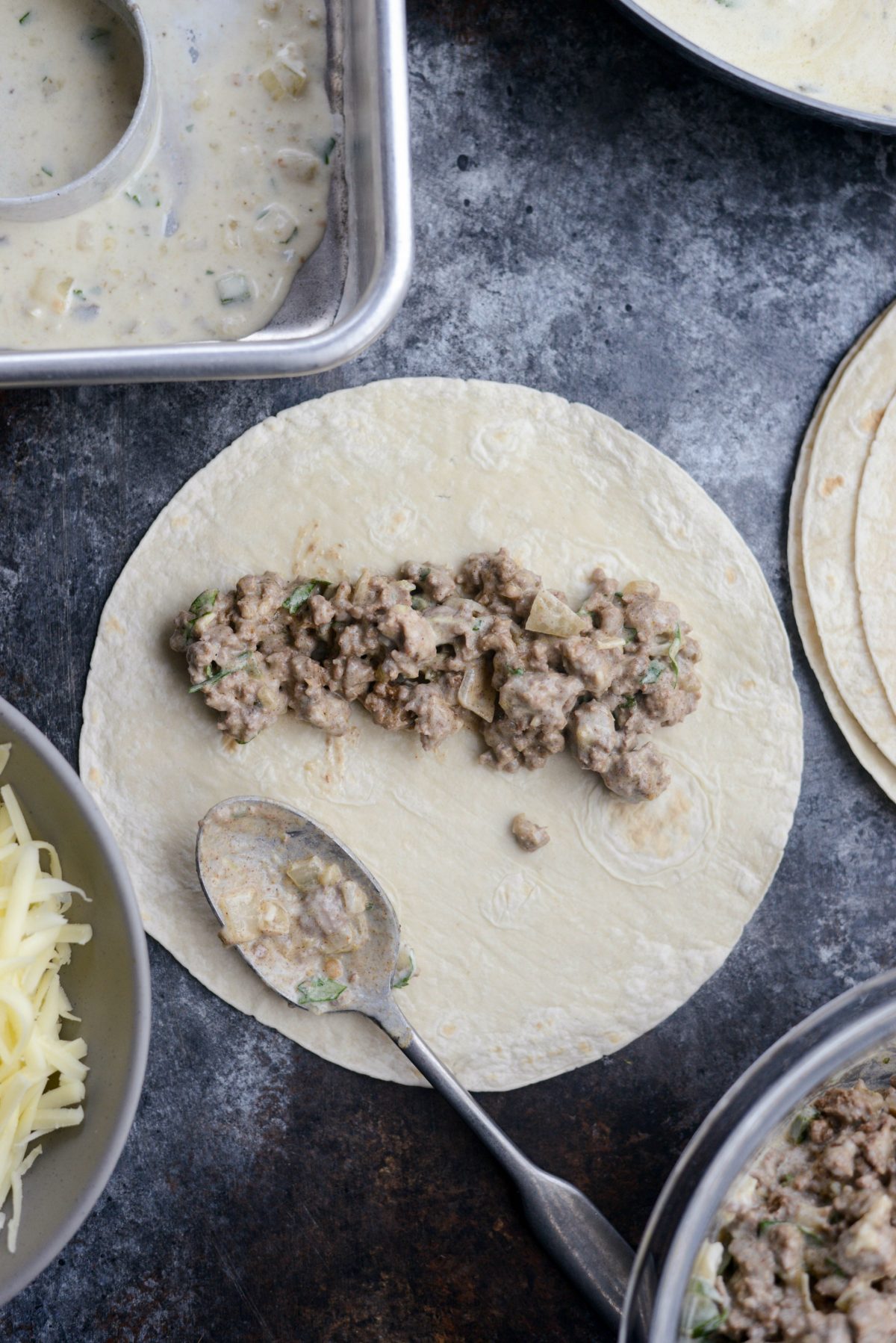 spoon some meat mixture on a tortilla