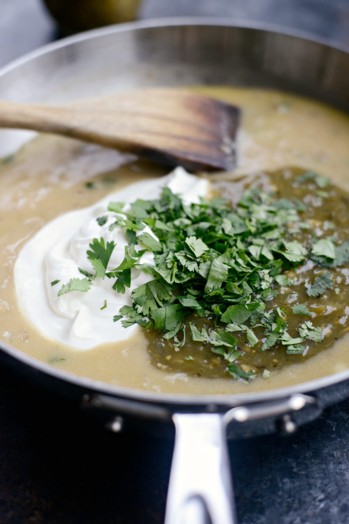 add in salsa verde, cilantro and sour cream