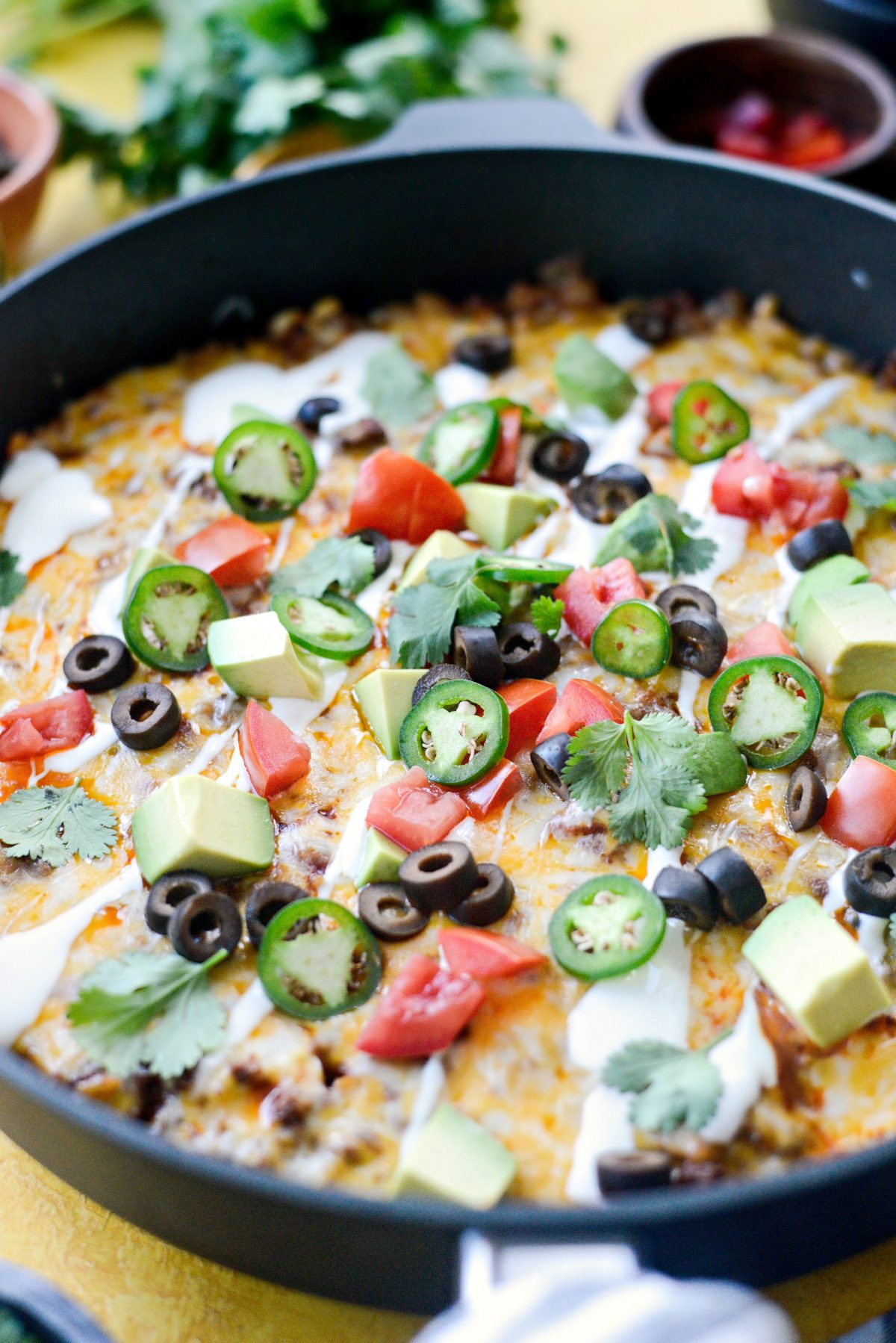 Top the cheesy mexican beef and rice skillet with desired toppings
